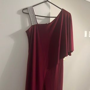 It’s a pantsuit with a rhinestone shoulder. It’s like a red purple